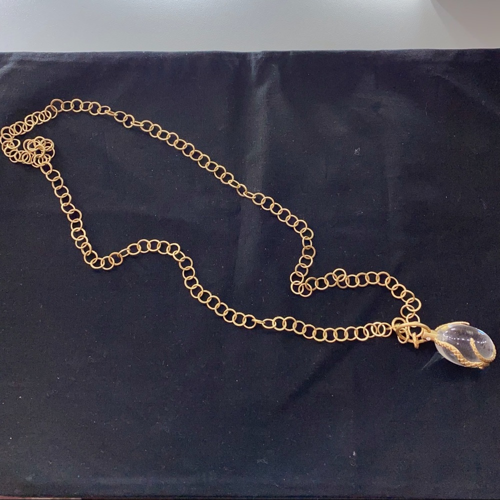Gold tone serpent necklace